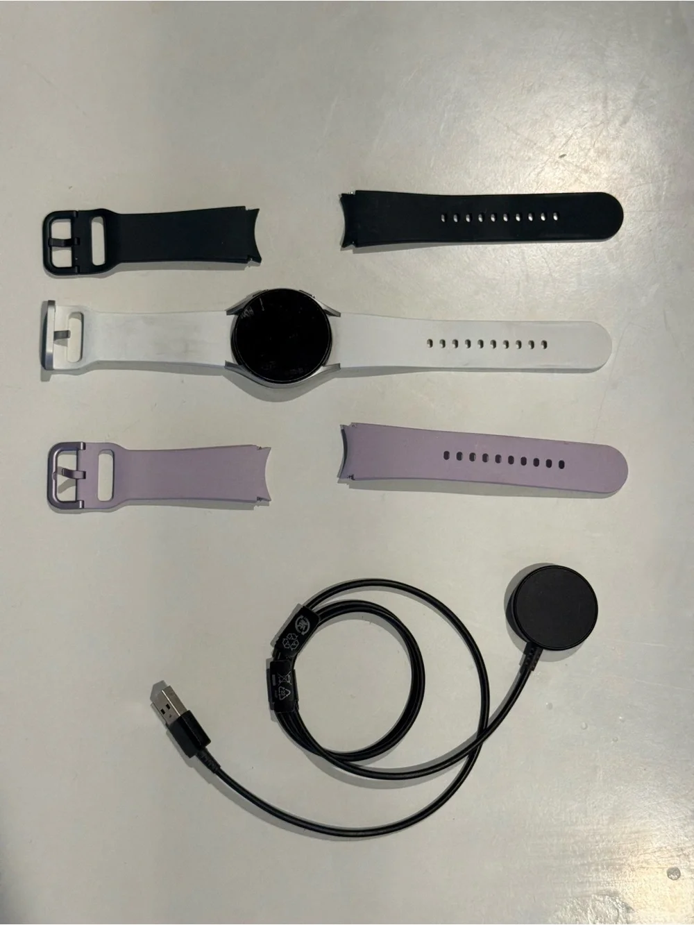 Samsung Galaxy Watch 4 - 40mm with White, Green, and Lavender Silicone Bands